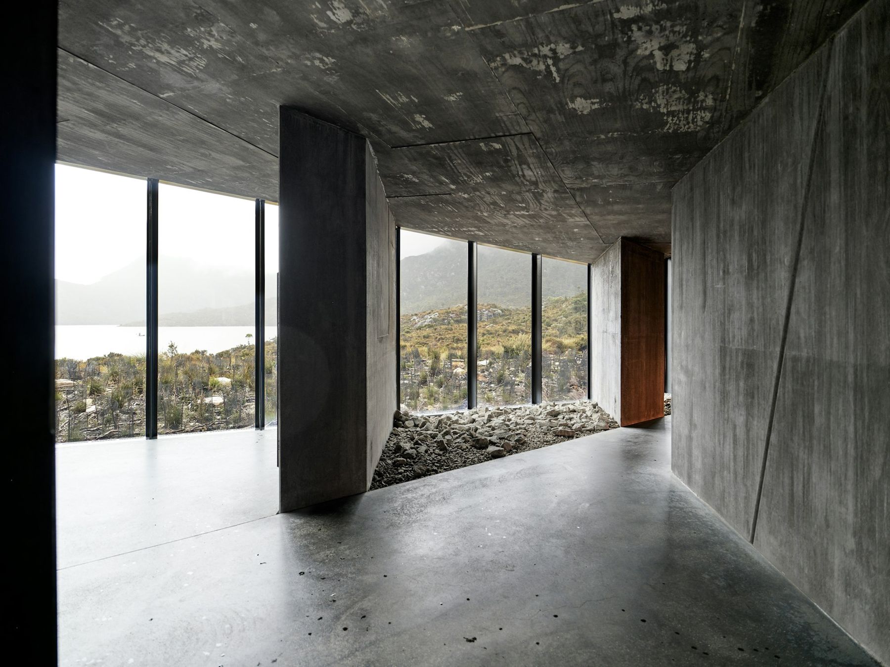 Polished concrete floor in a room with large windows